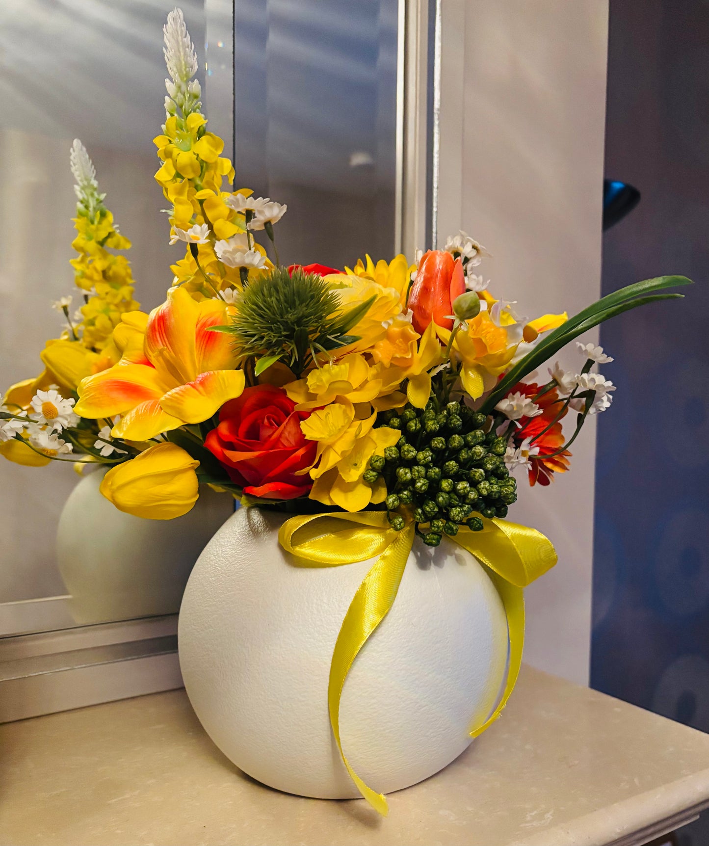 Yellow bouquet in round vase