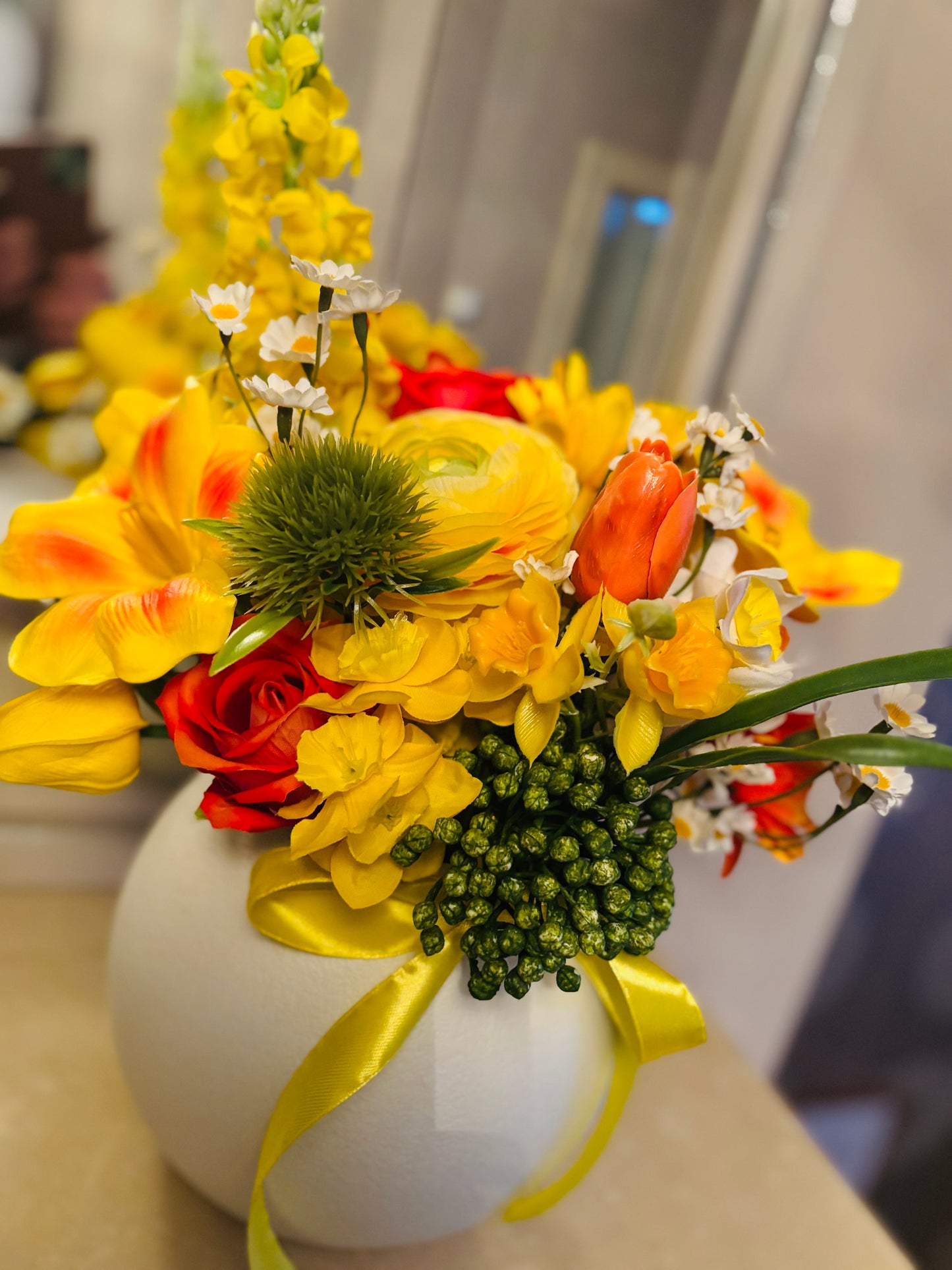 Yellow bouquet in round vase