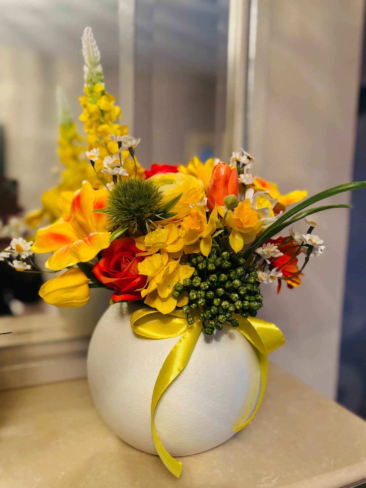 Yellow bouquet in round vase
