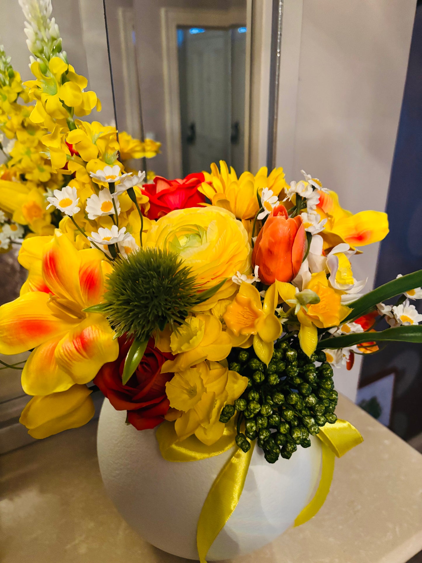 Yellow bouquet in round vase